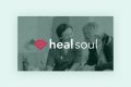 A healthcare professional smiles and talks with an older man; over the image is a pink heart icon and the text healsoul.