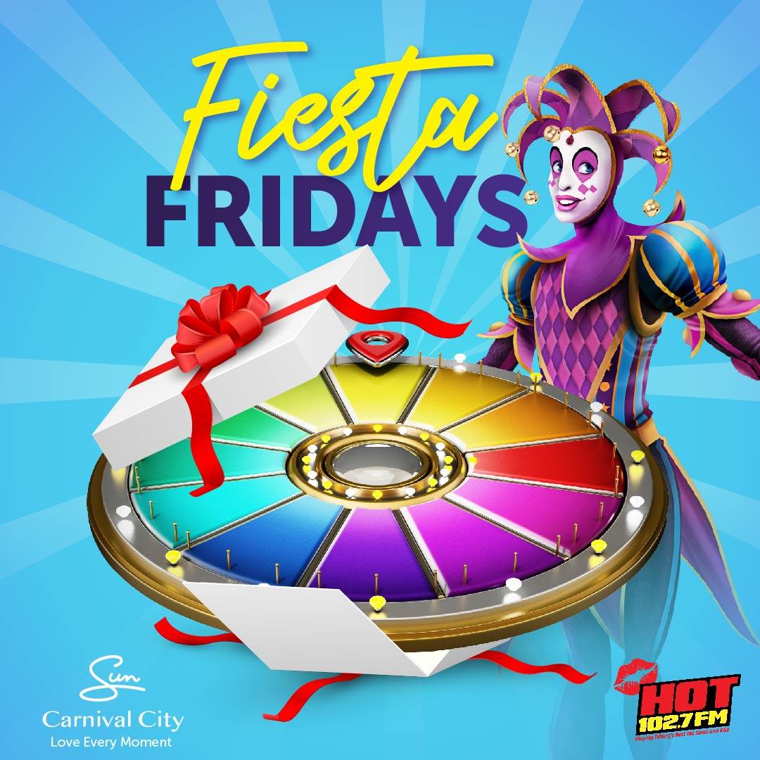 A colorful prize wheel in a gift box with a red bow is shown next to a smiling jester in a purple costume. Text reads Fiesta Fridays. Logos for Sun Carnival City and Hot 102.7 FM appear at the bottom.