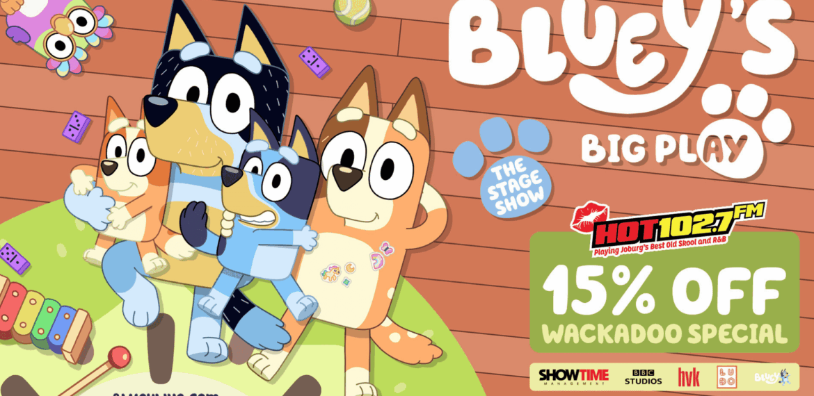 Four cartoon dogs from Bluey sit together on a playroom floor, surrounded by toys. Text promotes Blueys Big Play stage show and a 15% off Wackadoo Special offer with HOT102.7 FM. Dont miss the excitement of Big Play fun!.