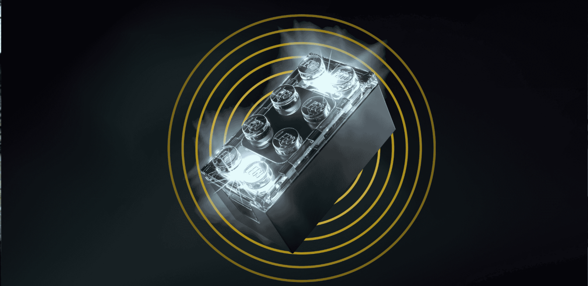 A glowing black toy brick, similar to a LEGO, emits light and mist against a dark background, with yellow concentric circles radiating outward like cover versions remixing familiar themes.