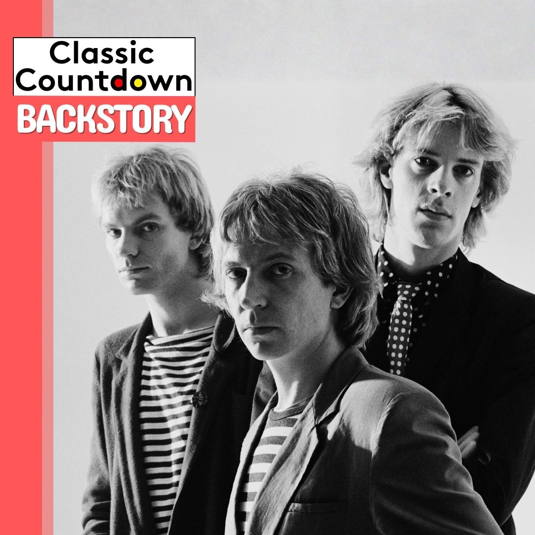 Black-and-white photo of three men in striped shirts and jackets, standing together. The Classic Countdown Backstory logo overlays the top left corner, evoking a "Last Christmas" nostalgia with its bold red and white background.