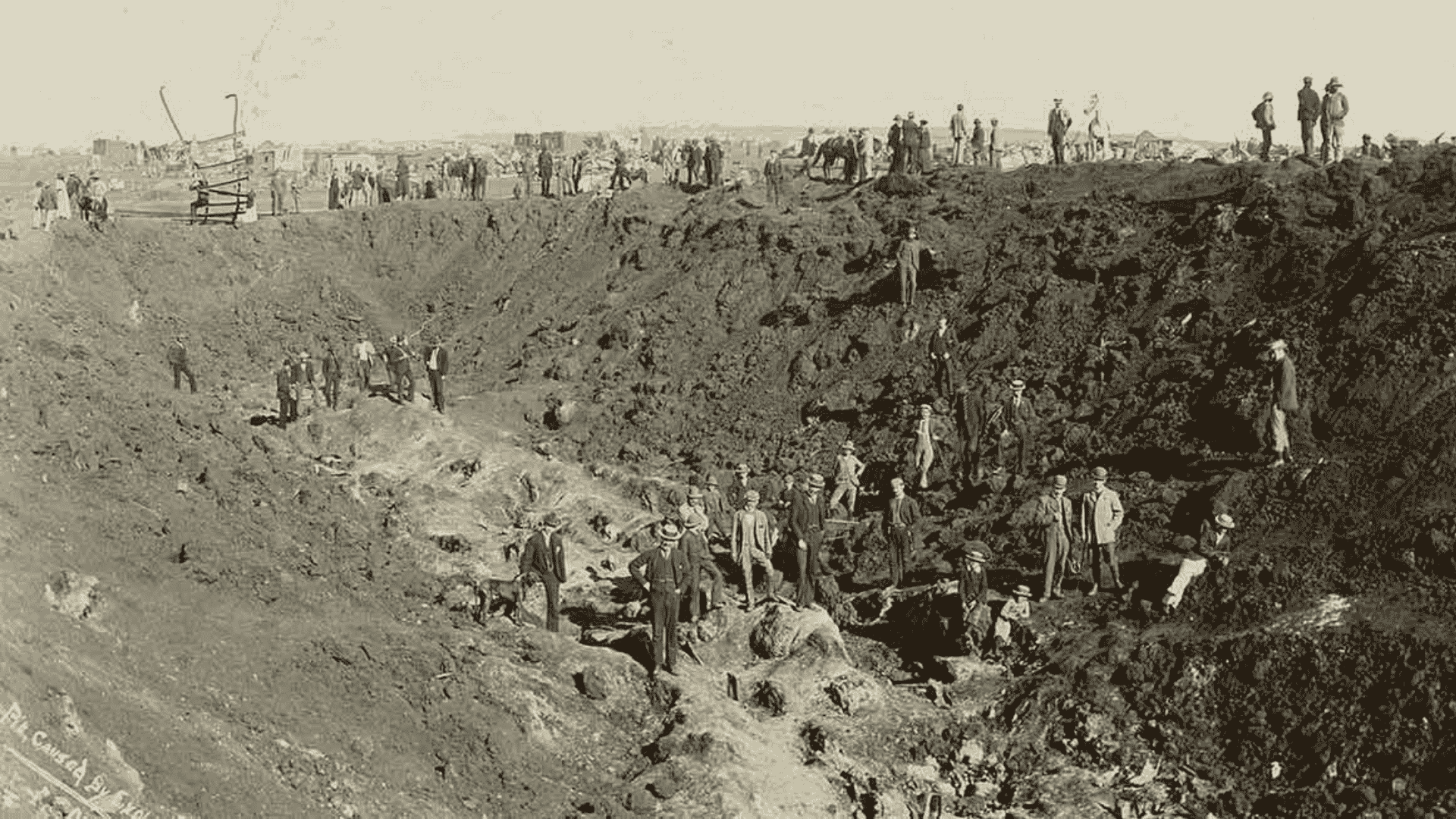 Historical photo of many people working in a large, deep excavation site—much like the vibrant eras Miriam Makeba witnessed—shows dirt mounds and workers scattered throughout the scene.