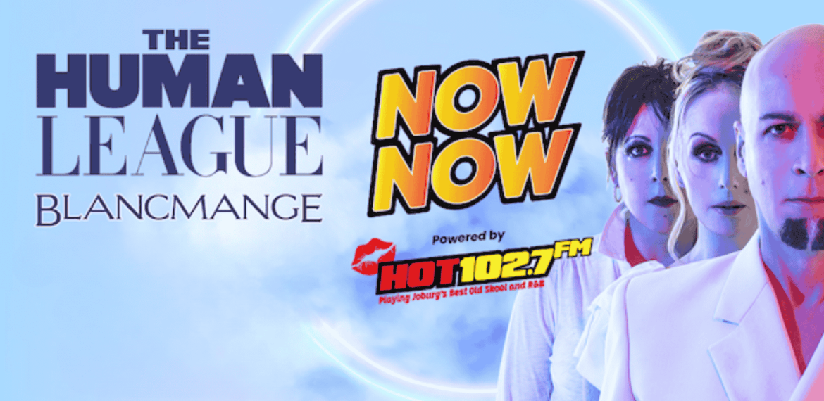 Promotional poster featuring Human League and Blancmange, with bold text Now Now and Powered by Hot 102.7 FM, alongside three band members in white outfits against a blue background with a glowing circle.