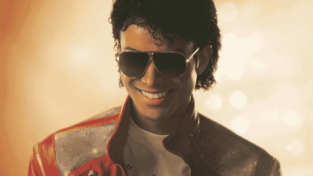 A person with curly hair wearing sunglasses, a red and silver jacket, and a white shirt smiles against a golden, softly lit background, evoking the vibrant style of Miriam Makeba.