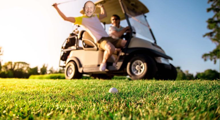 Two people are near a golf cart on a sunny golf course. One person is swinging a golf club, smiling, while the other watches from the driver’s seat—enjoying their morning with Hot 1027 Breakfast as a golf ball sits on the grass in the foreground.