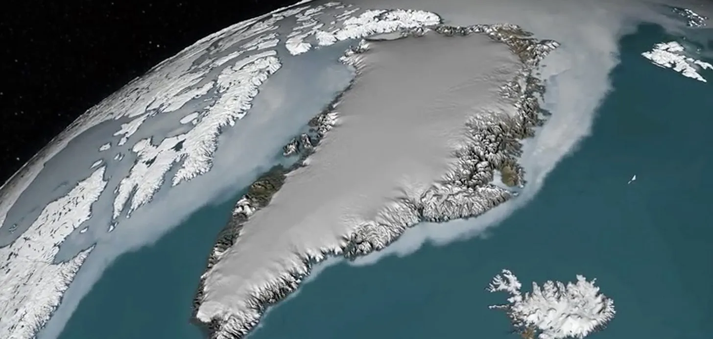 A satellite view of Greenland covered in ice, surrounded by blue ocean and nearby snow-covered islands, with Iceland and Middelpos visible to the southeast. The image shows the curvature of the Earth against the darkness of space.