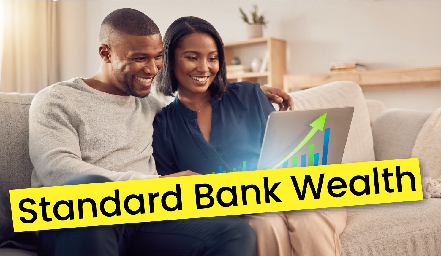 A smiling couple sits on a couch, looking at a laptop with a rising graph on the screen. Large yellow text across the image reads Standard Bank Wealth.