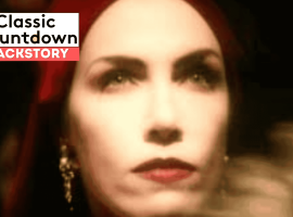 A close-up of a woman with red lipstick and a red headscarf, wearing drop earrings. The image is softly focused. Overlay text reads “Classic Countdown Backstory” in bold white and black letters on a red and white background.