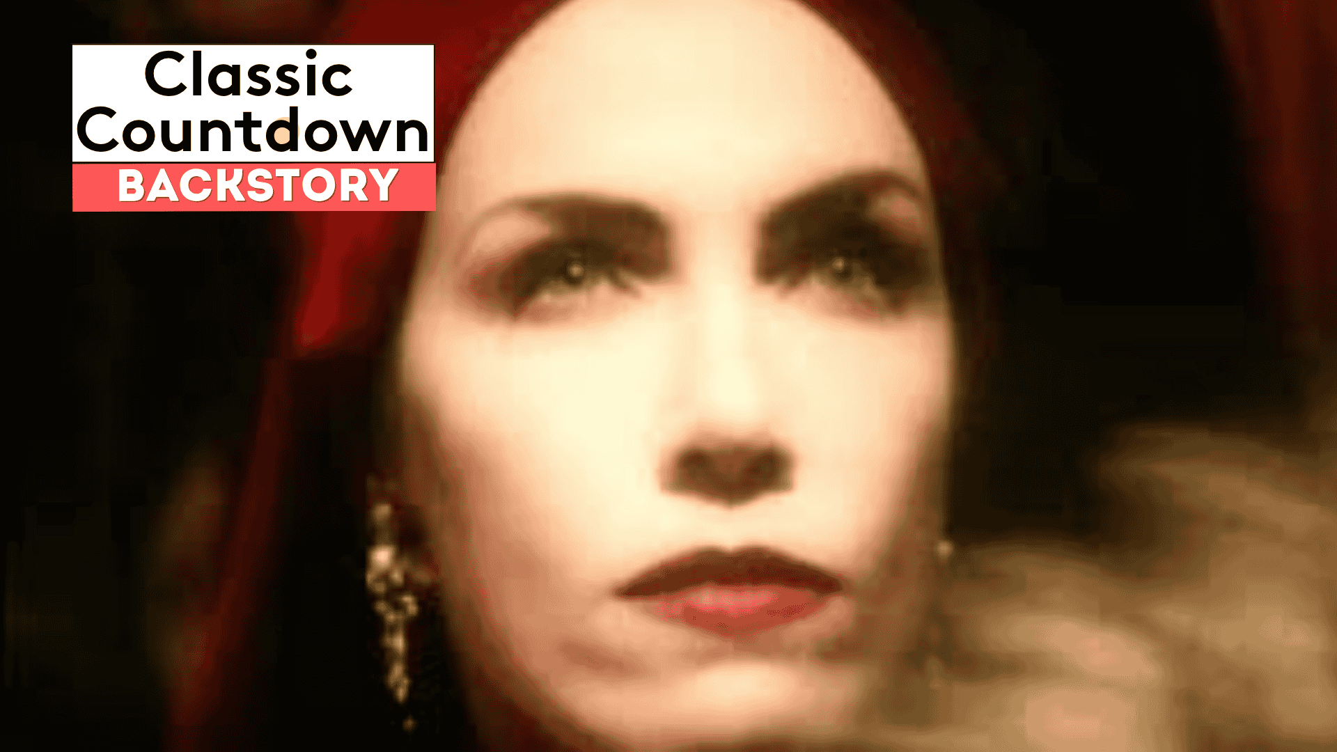A close-up of a woman with red lipstick and a red headscarf, wearing drop earrings. The image is softly focused. Overlay text reads “Classic Countdown Backstory” in bold white and black letters on a red and white background.