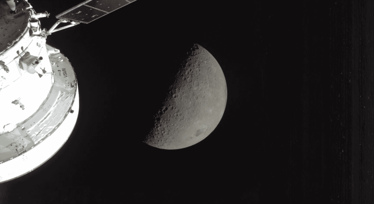 A spacecraft orbits the Moon, capturing a detailed view of the lunar surface with craters visible on the sunlit half, while improved fuel relief ensures efficient travel through the vast blackness of space.