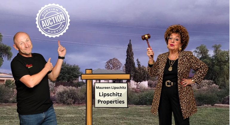 A smiling man in a black shirt points at an auction sign for “Lipschitz Properties” beside a woman in leopard print with a gavel, against cloudy skies and trees—Johannesburg water issues make this property auction stand out. An auction stamp appears overhead.