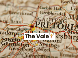 A close-up map of South Africa highlights Pretoria with a red circle and label. The words The Vale, along with a trophy icon, appear over the map near Johannesburg, Soweto, Germiston, and Middelpos.