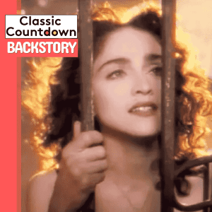 A woman with curly hair and red lipstick looks through metal bars, holding them with both hands. There is a warm, glowing light behind her. Text on the image reads Classic Countdown BACKSTORY.