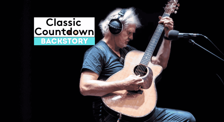 A man wearing headphones plays an acoustic guitar in a recording studio. To his left, text reads Classic Countdown Backstory on a dark background, setting the stage for a Backstory special featuring Robert Palmer’s musical journey.