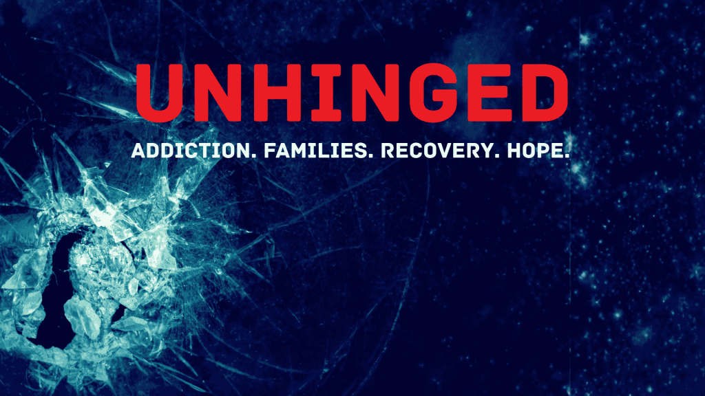A shattered glass forms a silhouette of a person’s head on a dark blue background. Bold red text reads UNHINGED and white text below says Addiction. Families. Recovery. Hope.