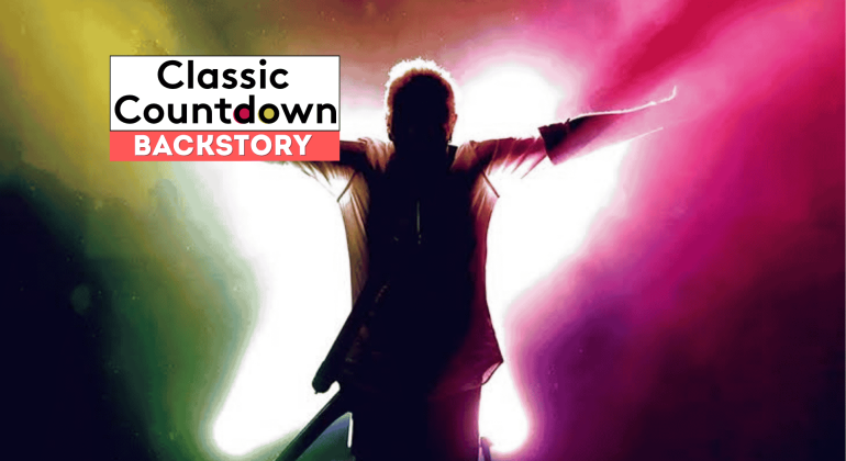 A person stands with arms outstretched in front of a bright, colorful background. The text Classic Countdown BACKSTORY appears in the top left corner, offering a glimpse into the backstory of icons like Robert Palmer.