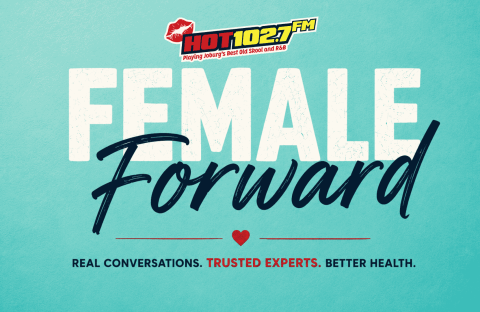 Hot 102.7 FM logo above large text FEMALE Forward. Below, a heart icon and the slogan: Real conversations. Trusted experts. Better health&mdash;featuring special focus on Shona breast cancer awareness. Light blue background.