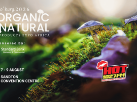 Close-up of mushrooms and green moss with event details for “Jo’burg 2026 Organic & Natural Products Expo Africa.” Sponsors include Standard Bank and HOT 102.7 FM. Event at Sandton Convention Centre, 7-9 August.