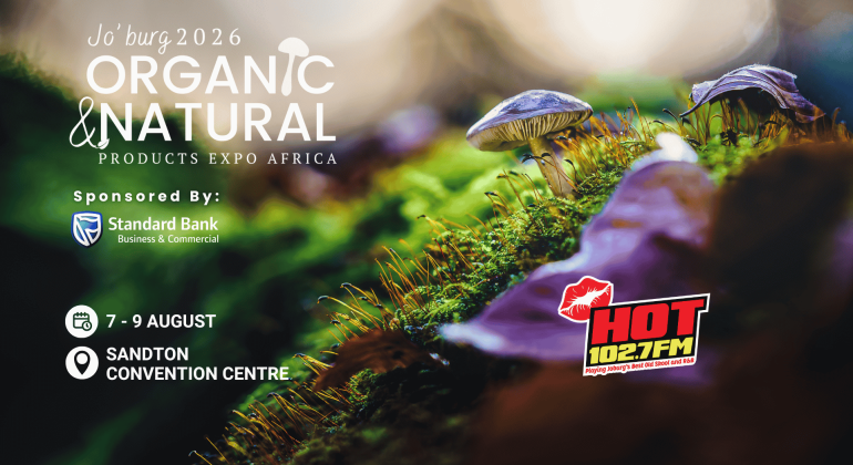 Close-up of mushrooms and green moss with event details for “Jo’burg 2026 Organic & Natural Products Expo Africa.” Sponsors include Standard Bank and HOT 102.7 FM. Event at Sandton Convention Centre, 7-9 August.
