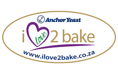 Anchor Yeast logo with text: i love 2 bake (with love in a heart shape), Amex accepted, and website www.ilove2bake.co.za inside a gold oval border.