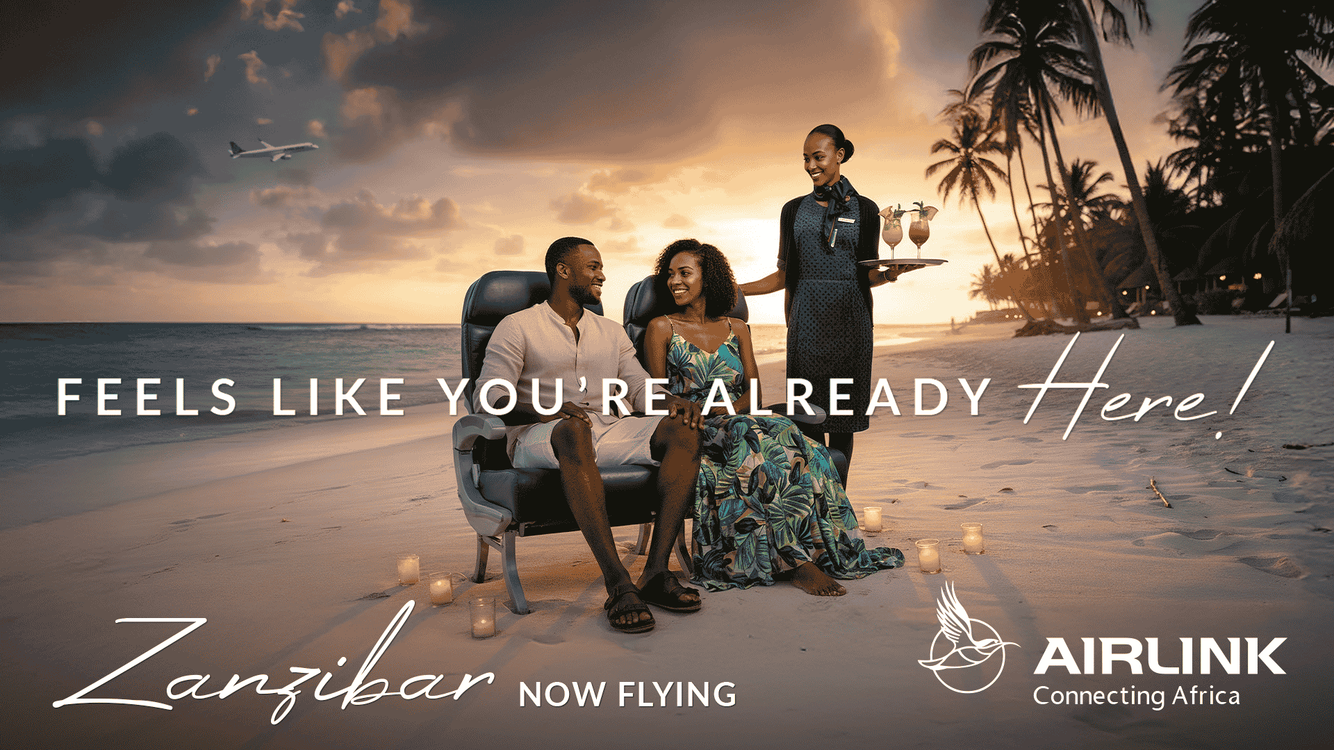 A couple relaxes on armchairs at sunset on a tropical beach, served drinks by a smiling attendant. Text reads: FEELS LIKE YOU’RE ALREADY Here! Zanzibar NOW FLYING AIRLINK Connecting Africa. Pay with Amex for seamless bookings as an airplane flies overhead.