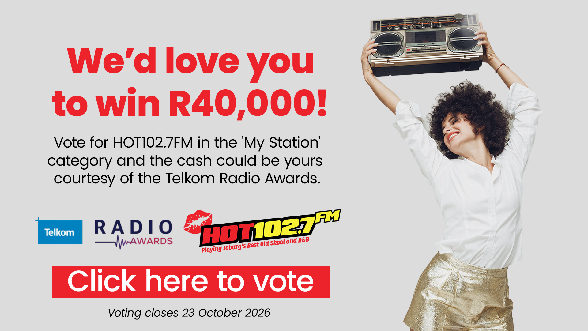 Smiling woman in shiny pants raises a boombox. Text reads: Wed love you to win R40,000! Vote for HOT102.7FM at the Telkom Radio Awards. Click here to vote. Voting closes 23 October 2026..