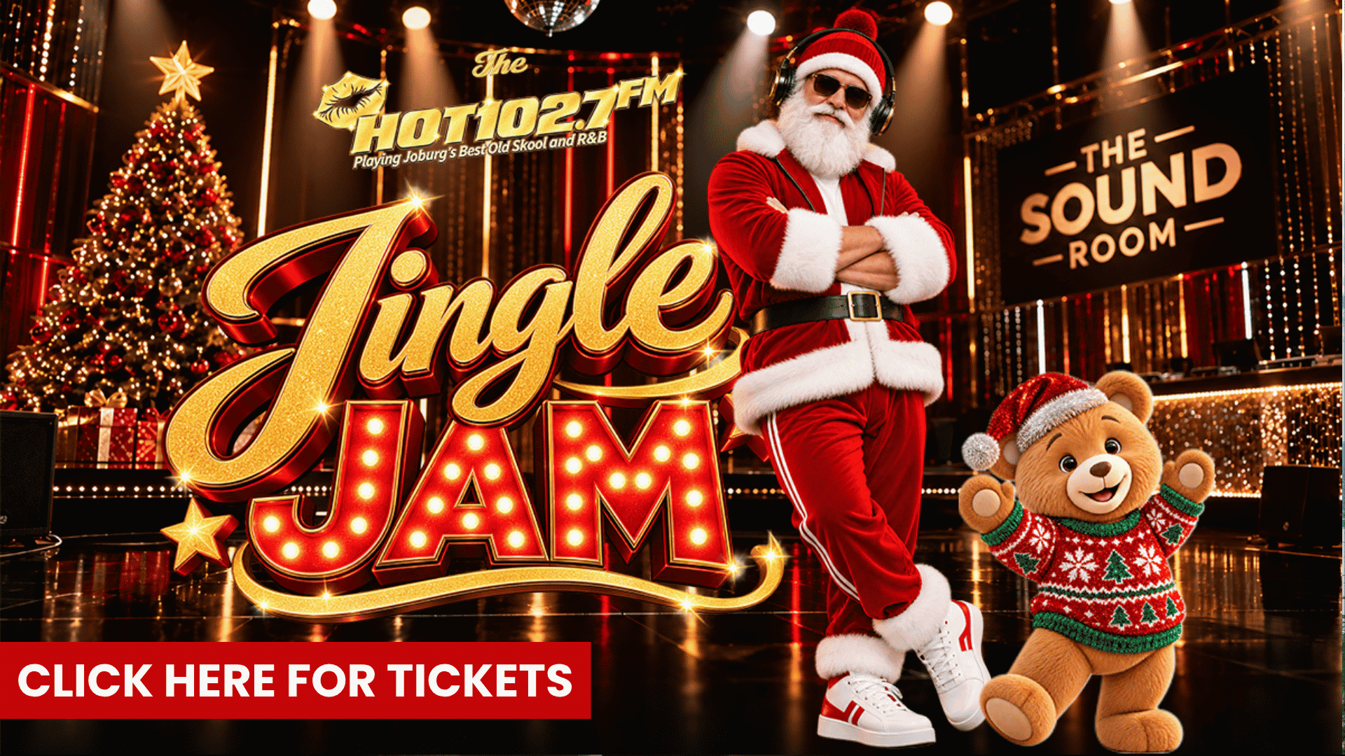 Santa Claus and a teddy bear standing on a stage decorated for the Hot 102.7FM Jingle Jam event, with a Click Here for Tickets button at the bottom.