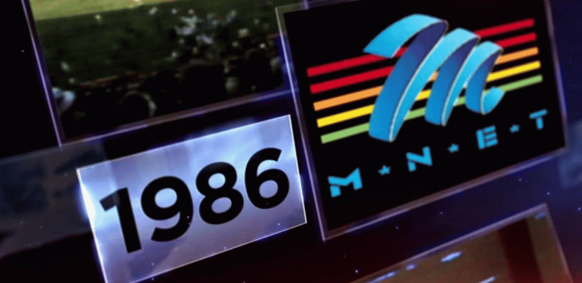 A graphic displays 1986 in bold black text next to the M-Net logo, which features a blue M and five colored stripes over the letters M-N-E-T on a black background.