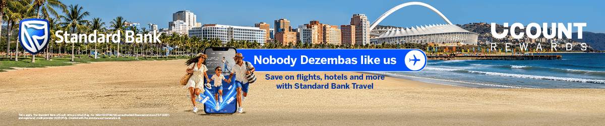 Standard Bank and UCount Rewards promotional banner featuring a family walking on a beach with a smartphone display and text reading: Nobody Dezembas like us. Save on travel, flights, hotels and more with Standard Bank.