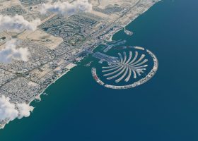 Aerial view of the Palm Jumeirah archipelago in Dubai extending into the Persian Gulf, a popular destination for travel.